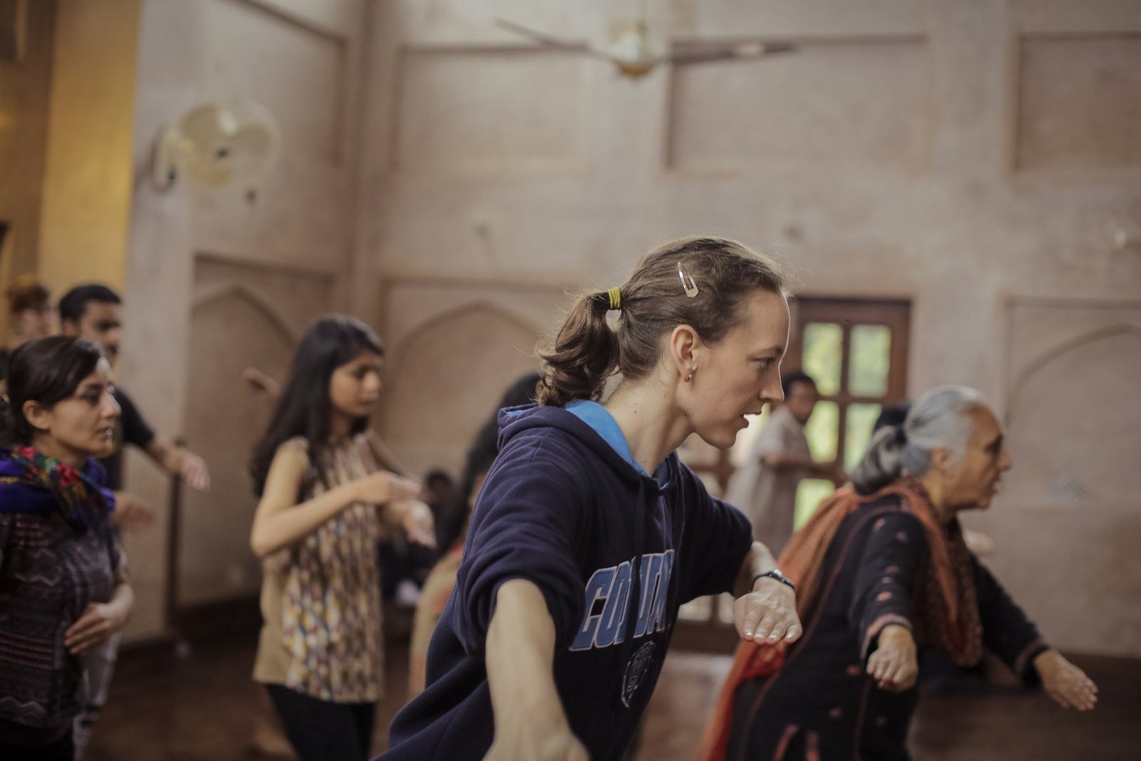Gillian learning kathak in a studio with an older woman