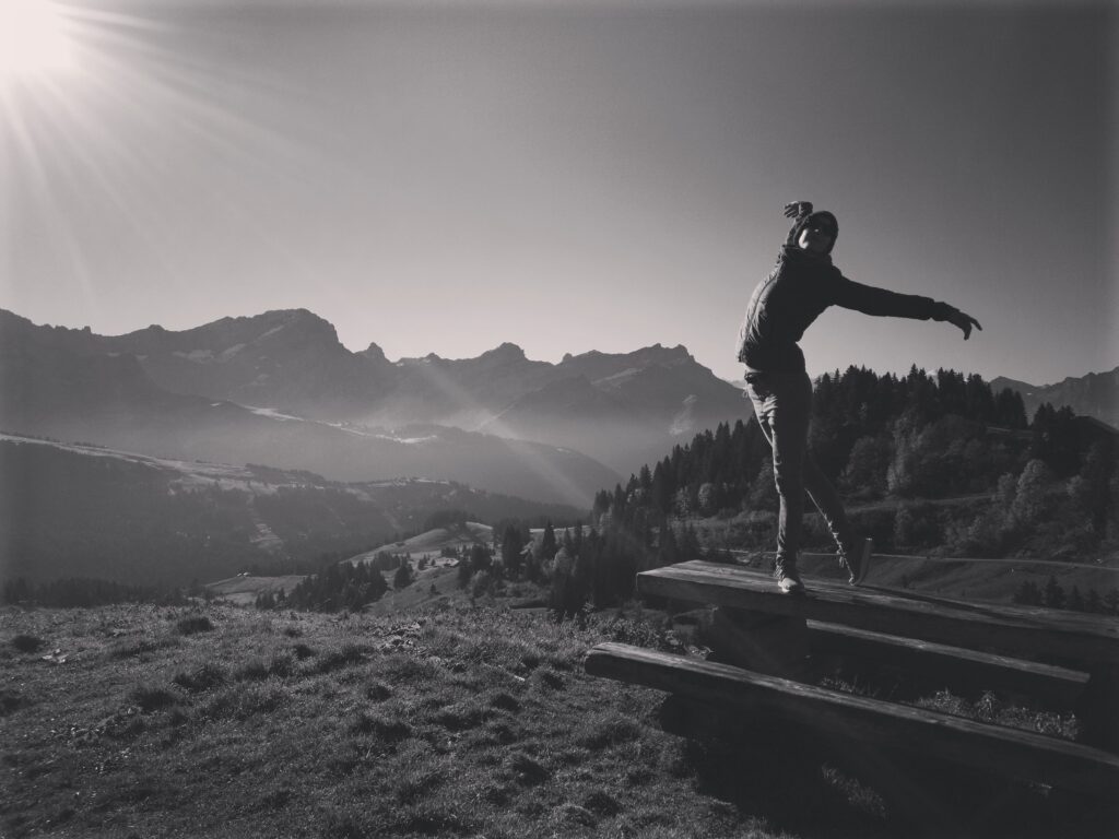 Gillian in silhouette against the mountains in a ballet pose