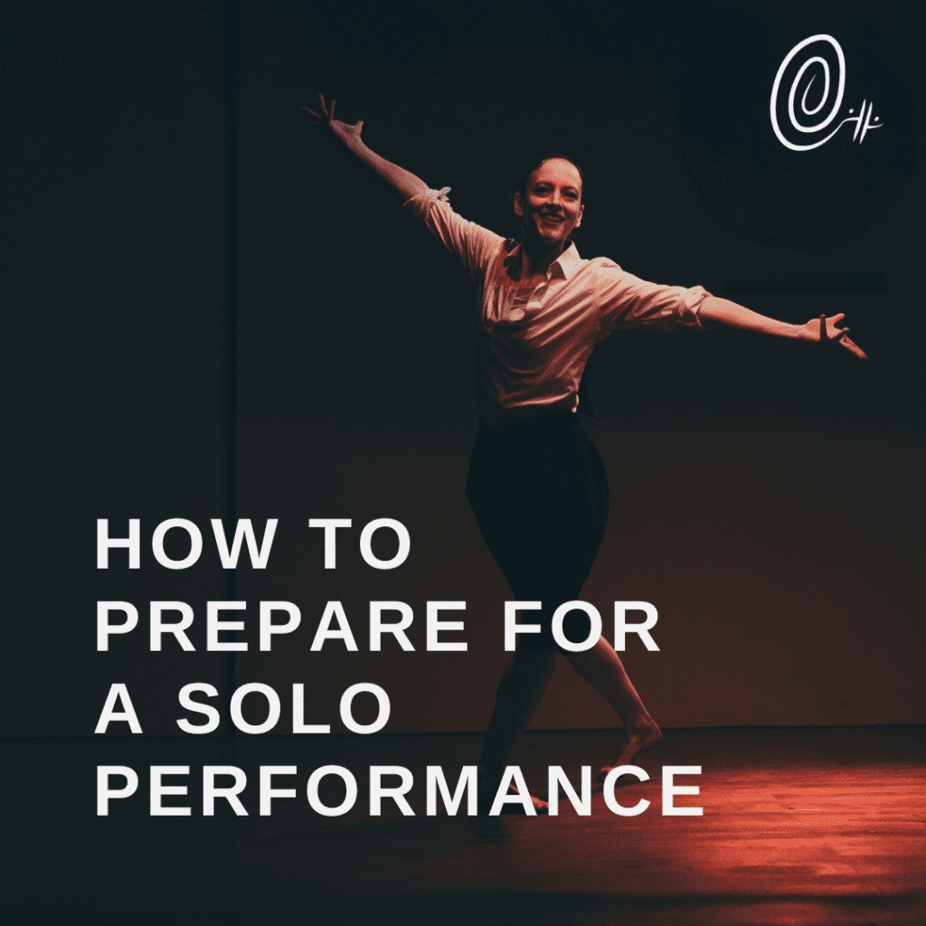 A dancer with arms outspread and smiling with the words how to prepare for solo performance overlaid