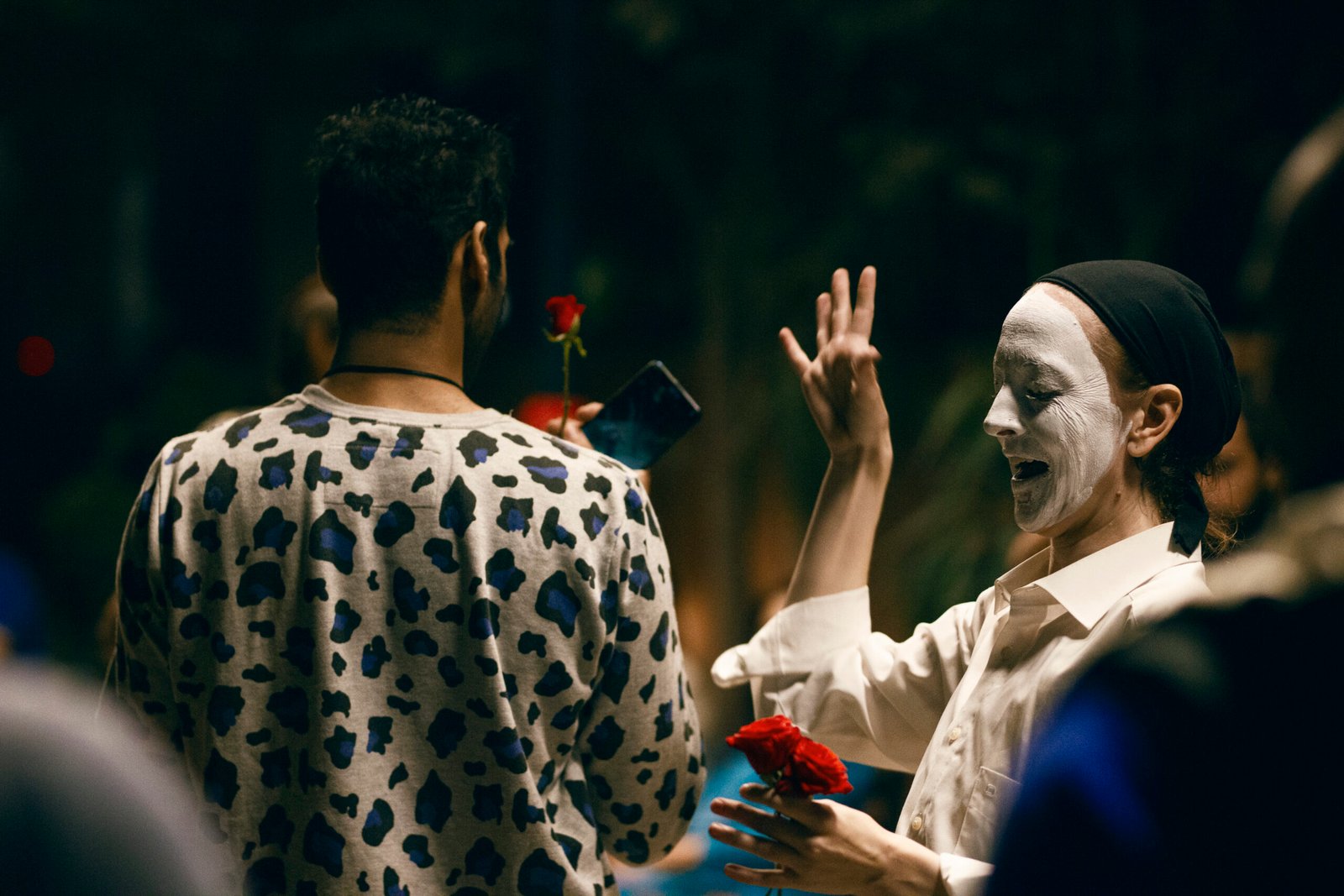 Gillian as pierrot performing in a group of people