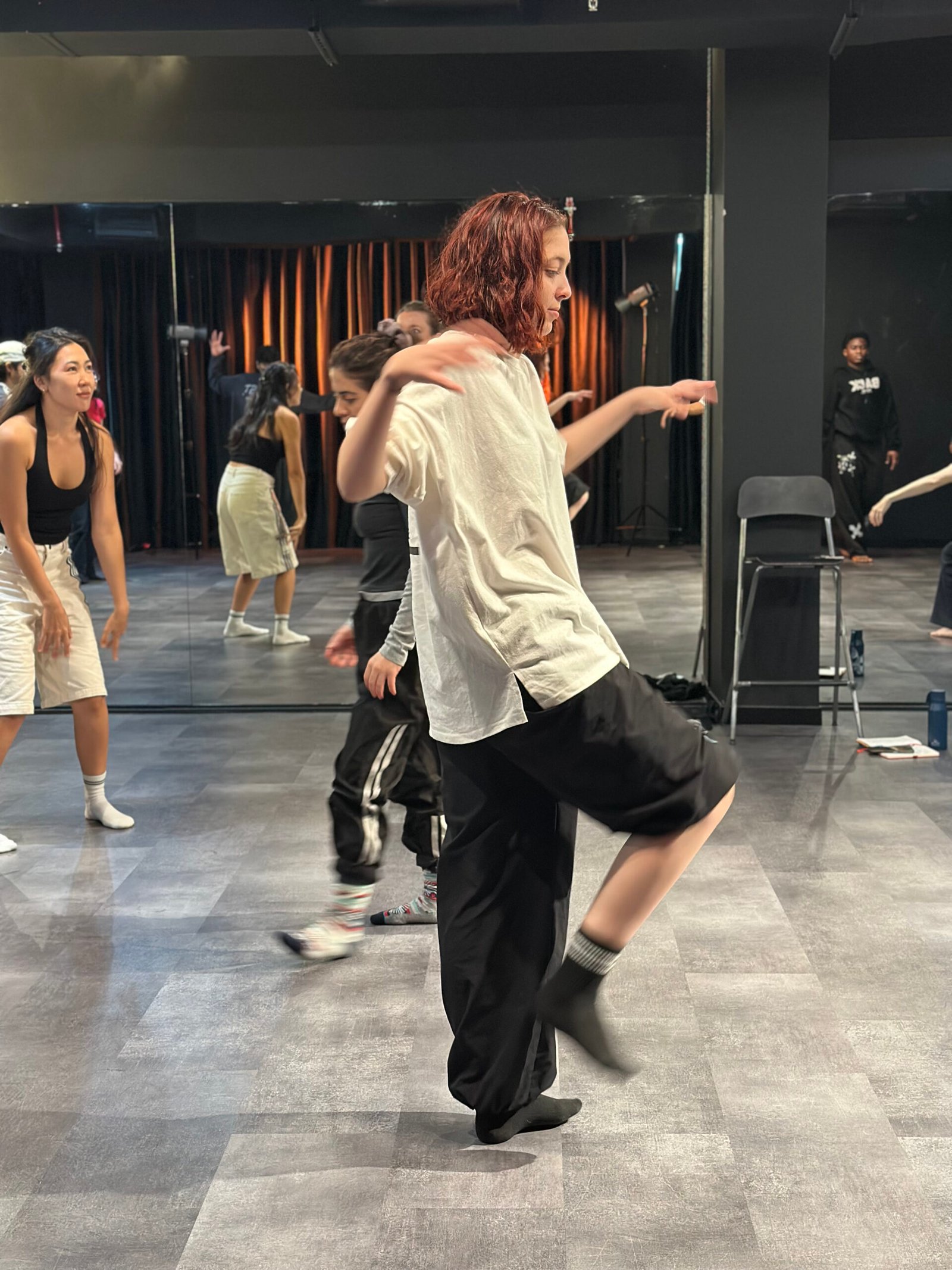 Ananda in mid step in a studio