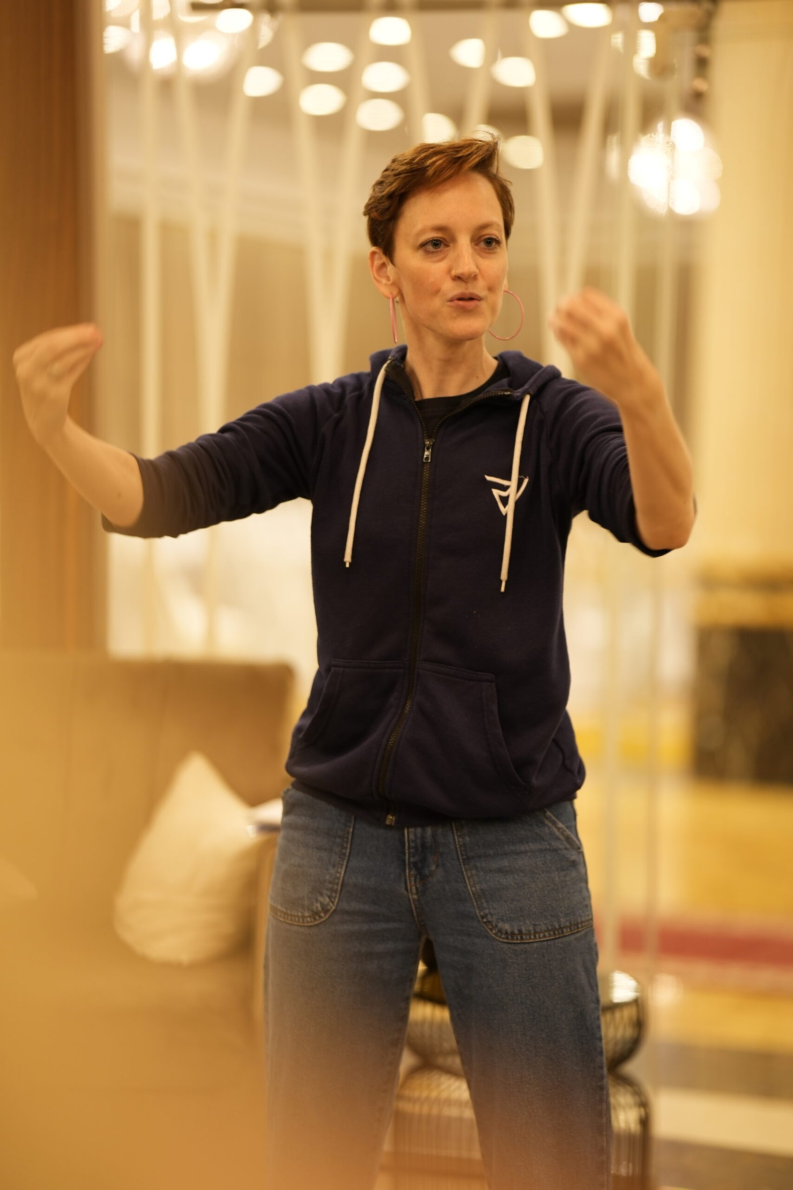 Gillian in the middle of speaking and gesturing