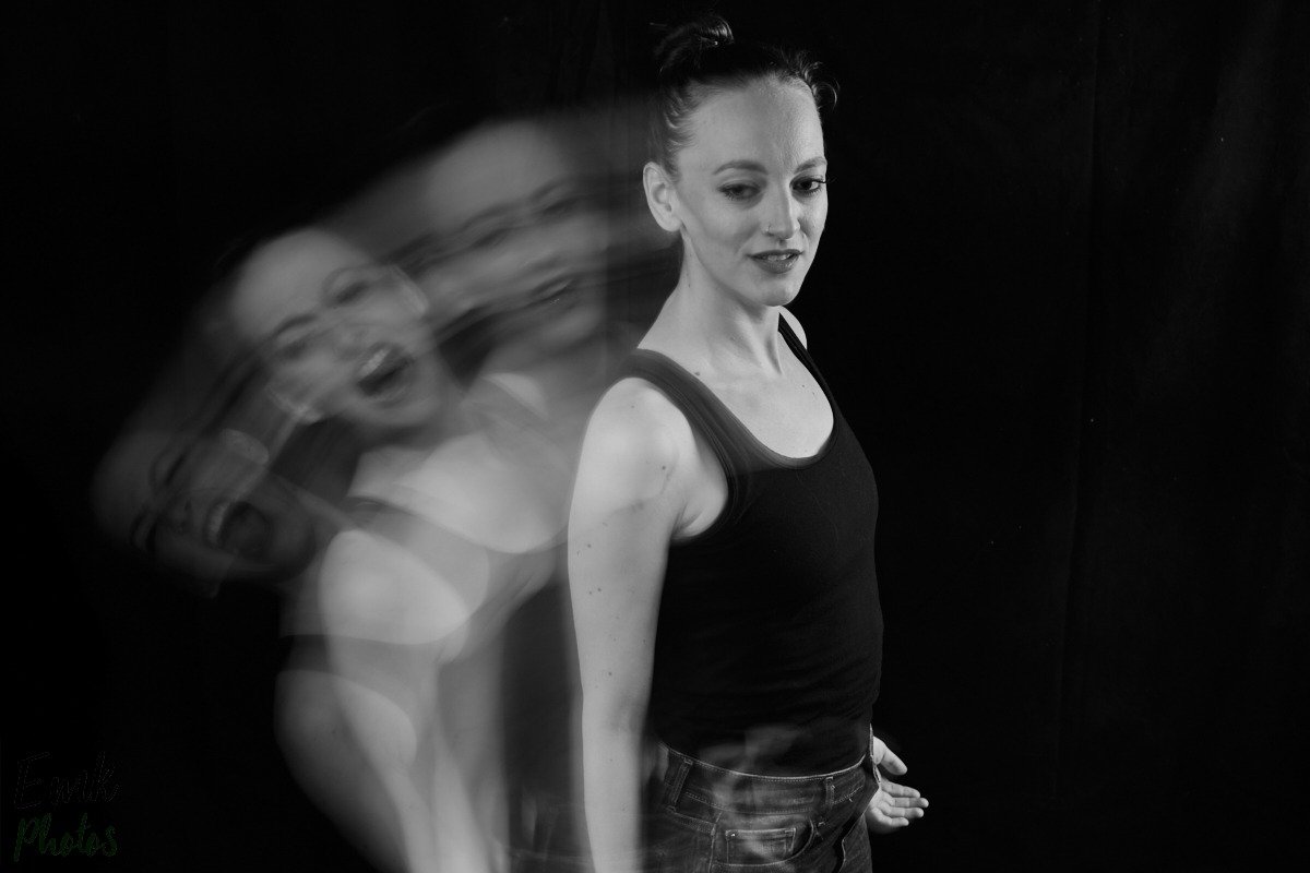 a long exposure shot of Gillian with four echo versions screaming into a smiling real version